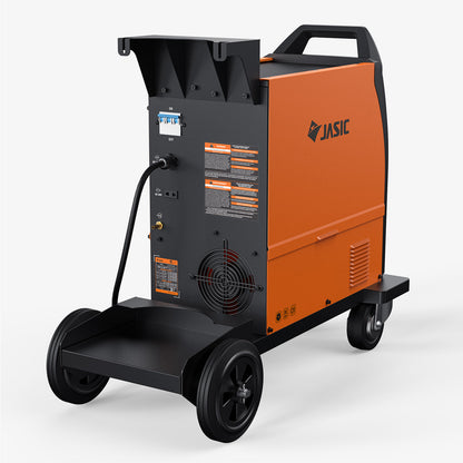 Industrial MIG welder with wheels, orange and black body, rear view showing power cord and fan.