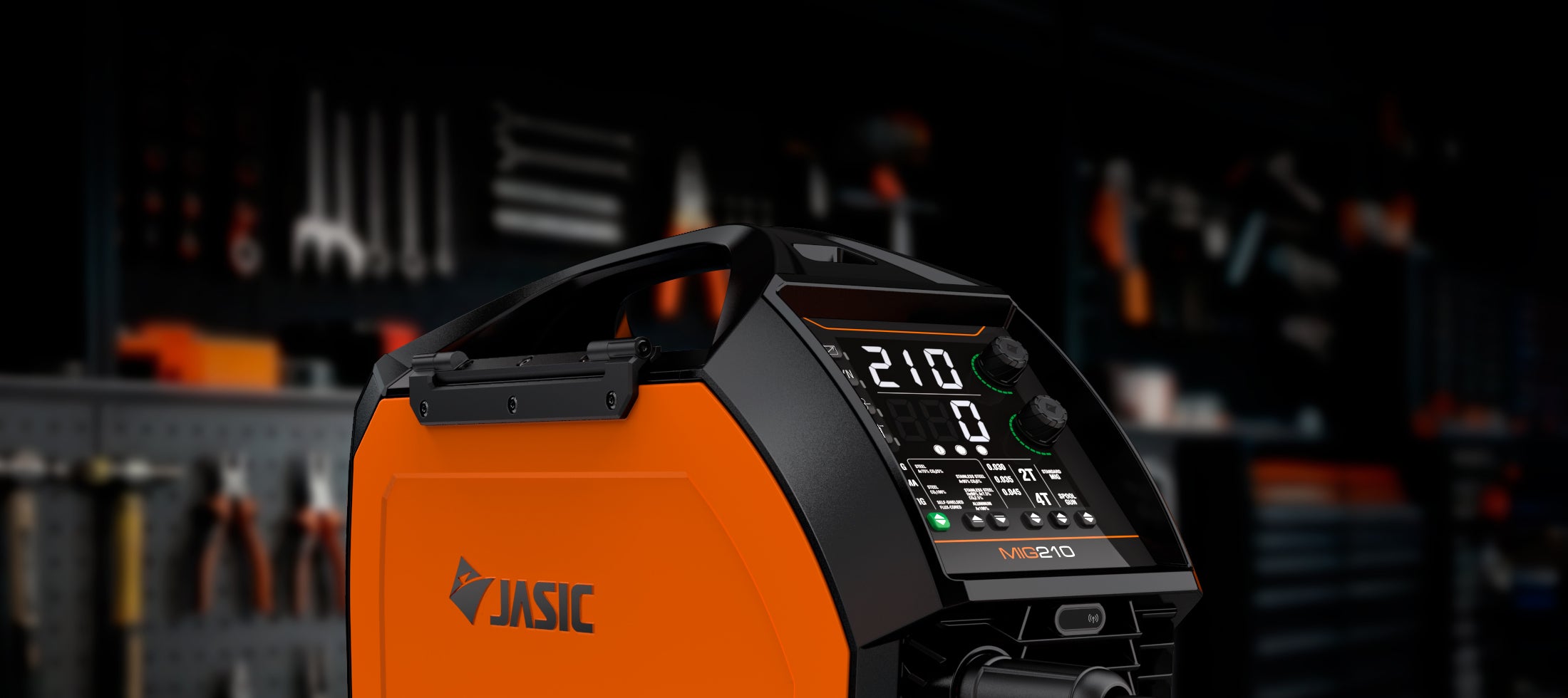 Close-up of orange MIG210 multi process welder with digital display in a workshop setting